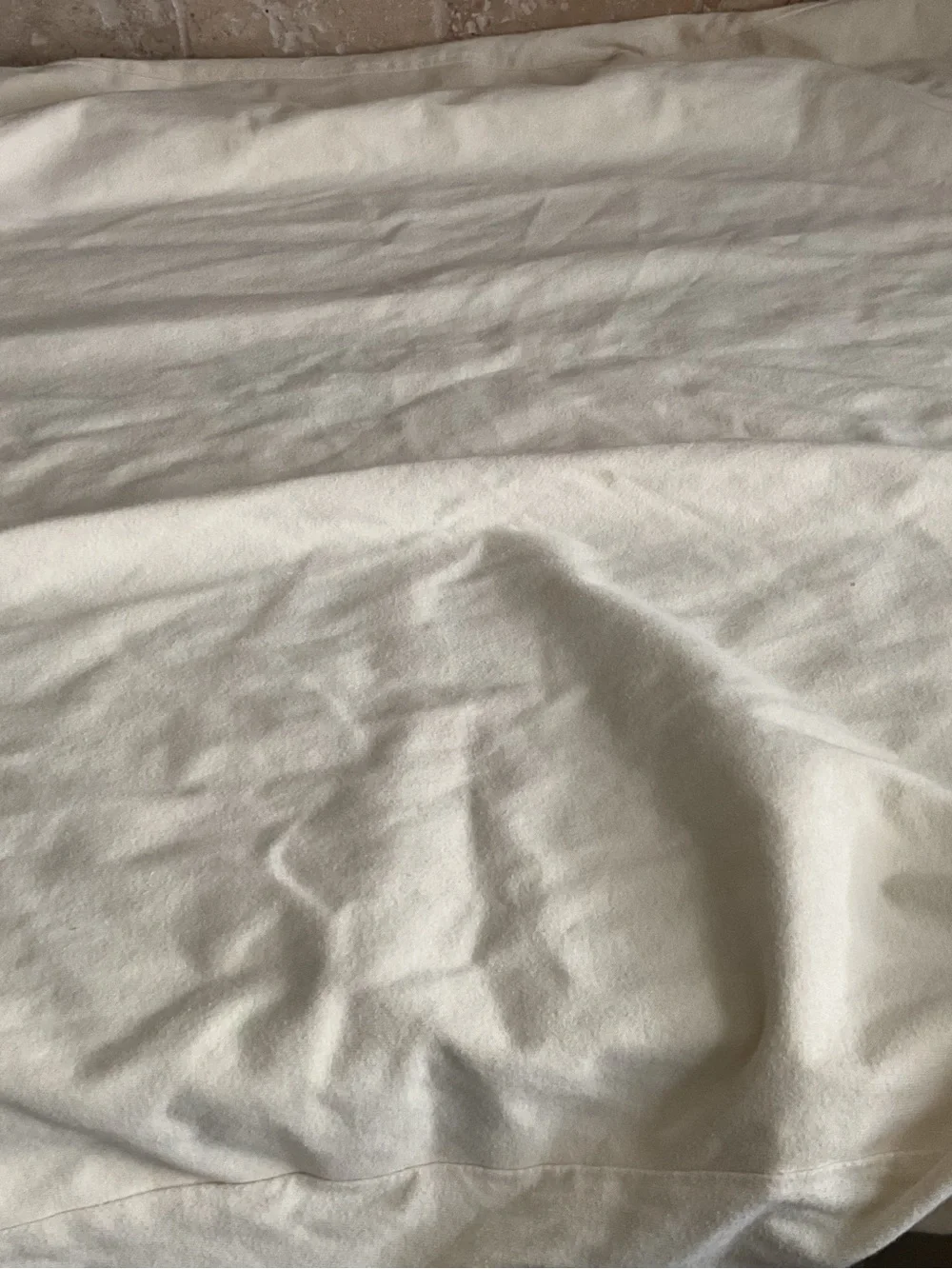 Organic cotton waterproof crib mattress protector by Naturepedic